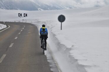 Man riding through the snow. We show you how to prepare your bike for winter