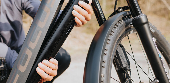 Bike battery being removed from a bike.