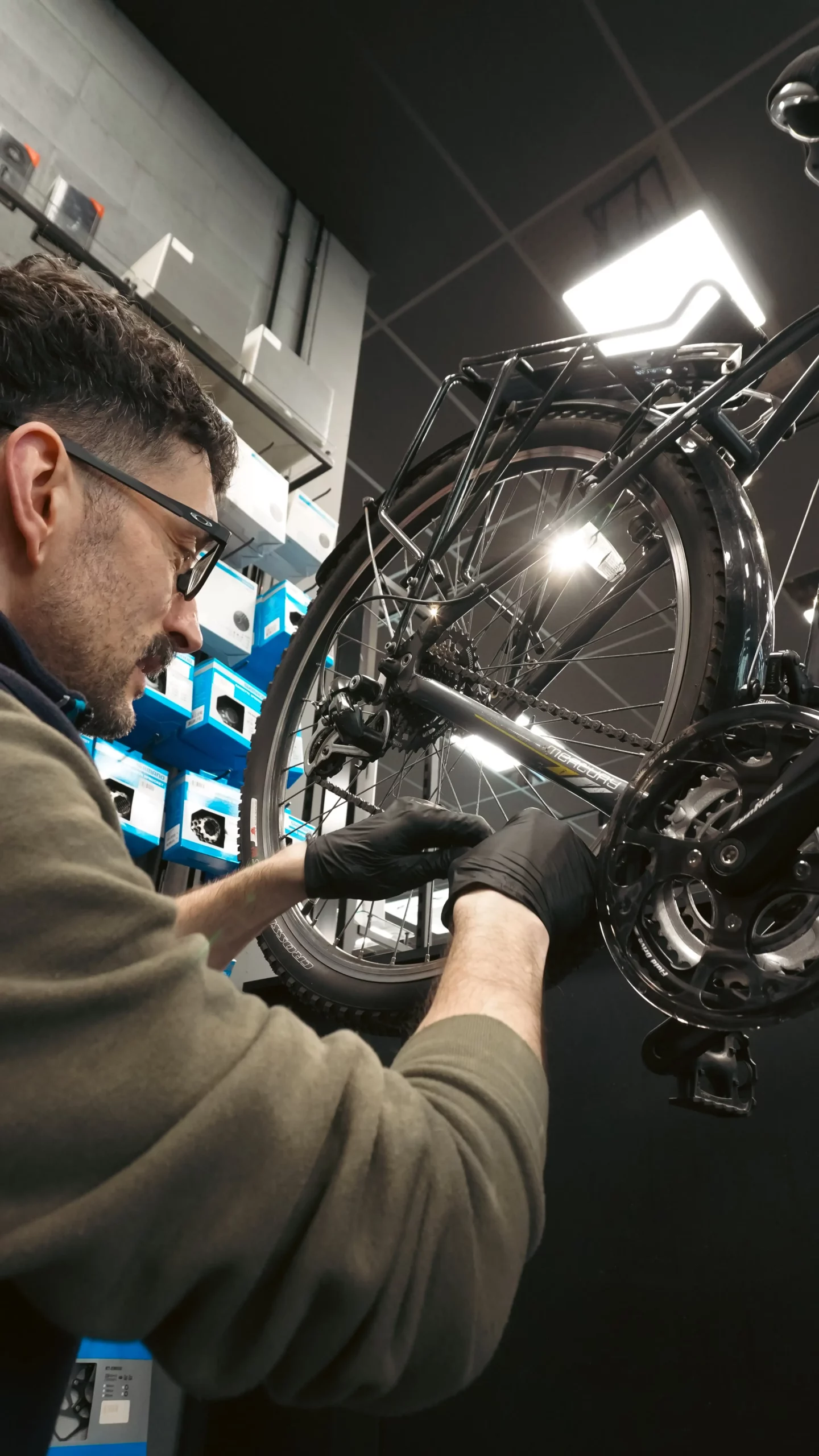 A man completing a Basic Service on a bike.