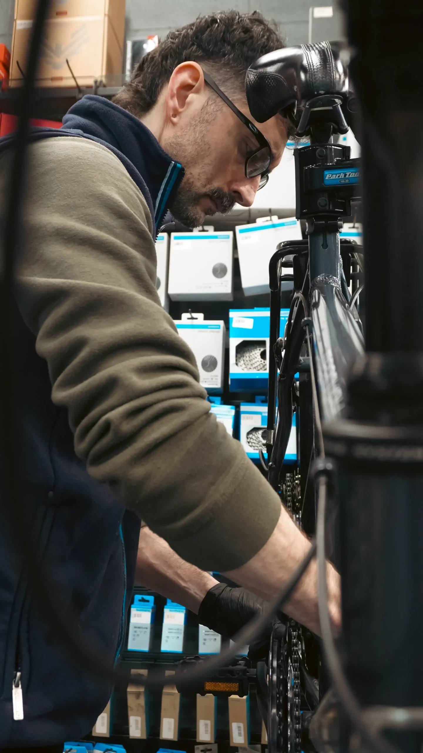 A man completing a Pro Service on a bike.